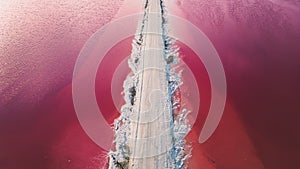 Aerial view of pink salt lake. Salt production plants evaporated brine pond in a salt lake.