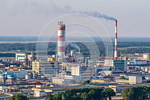 Aerial view on pipes of chemical enterprise plant. Air pollution concept. Industrial landscape environmental pollution waste of