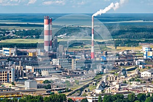 Aerial view on pipes of chemical enterprise plant. Air pollution concept. Industrial landscape environmental pollution waste of