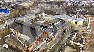 Aerial view of pitiful remnants of huge complex of buildings of old plant