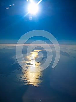 Aerial view from plane to morning sunrise over the ocean