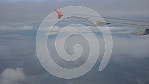 Aerial view from plane window over cloud scape