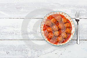 Aerial view of a plate meatballs in tomato sauce