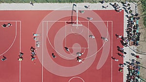 Aerial view of a player throwing the ball into the basket.