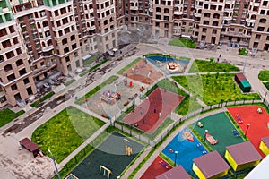 Aerial view playground for children and house building exterior mixed-use urban multi-family residential complex