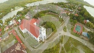 Aerial view Poblacion city with catholic church in the Philippines. Anda.