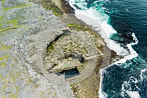 Aerial view of Poll na bPeist or the Wormhole. Natural rectangular shaped pool at the bottom of the cliffs, south of Dun Aonghasa