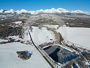 Aerial view of the pond in Strba and the High Tatras in Slovakia