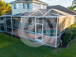Aerial view of pool screen enclosure surrounded by trees