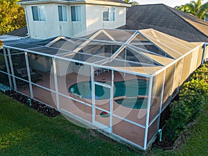 Aerial view of pool screen enclosure surrounded by trees