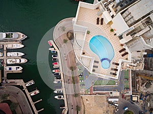 Aerial view of pool of water on the roof of a skyscraper in Dubai, UAE photo