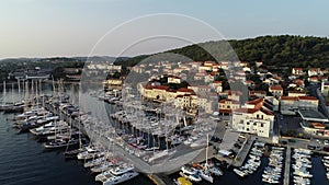 Aerial view of port or marina with sailboats and yachts in mediterranean city