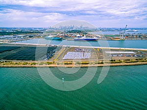 Aerial view of Port Melbourne with moored cargo vessels.