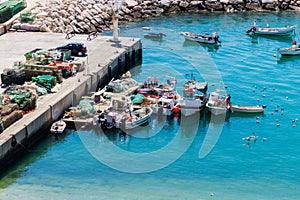 Aerial view of fihsing boats in the Porto de Abrigo de Albufeira, Albufeira Bay in Albufeira, Portugal photo