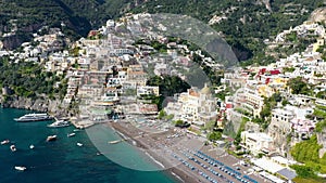 Aerial view of Positano with comfortable beach and blue sea on Amalfi Coast in Campania, Italy. Positano village on the Amalfi