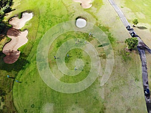 Aerial view of pound on golf course with player.