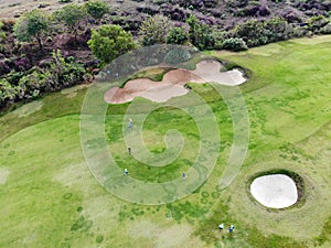 Aerial view of pound on golf course with player.