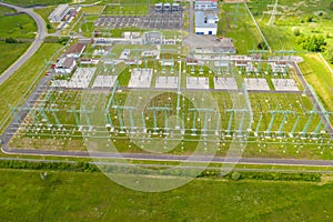 Aerial view power plant. High voltage electric power substation. Electrical transformer in voltage substation, cables and wires