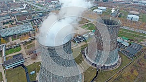 Aerial view of power plants, thermal power station. Smoking pipe at industrial area.