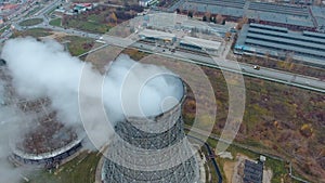 Aerial view of power plants, thermal power station. Smoking pipe at industrial area.