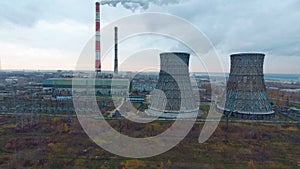 Aerial view of power plants, thermal power station. Smoking pipe at industrial area.