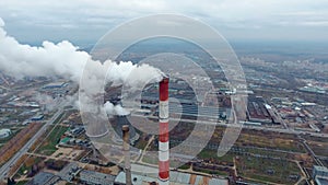 Aerial view of power plants, thermal power station. Smoking pipe at industrial area.