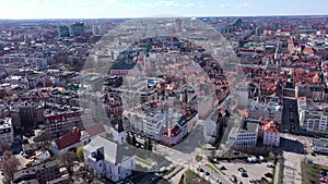 Aerial view of Poznan modern cityscape overlooking new residential areas and historical center on sunny spring day