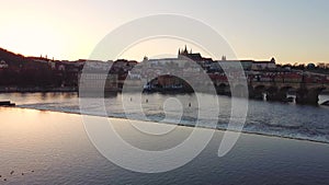 Aerial view of Prague Old Town architecture and Charles Bridge over Vltava river at sunset. Old Town of Prague, Czech