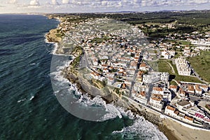 Aerial view of Praia das Macas little township along south Portuguese coastline facing the Atlantic Ocean, Colares, Portugal photo