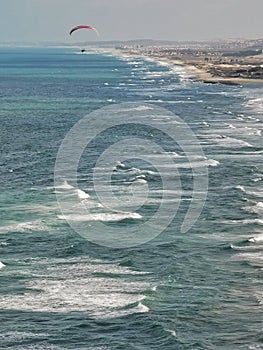 Aerial View of Praia do Futuro Beach, Fortaleza, CearÃÂ¡ Brazil with a paraglider flying. photo