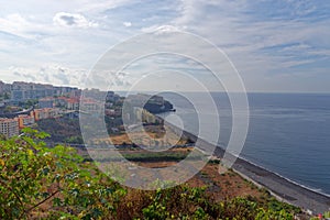 Aerial view of Praia Formosa beach and Funchal city on Portuguese island of Madeira