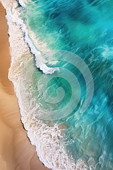 aerial view of a pristine, deserted beach with turquoise waves