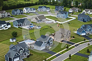 Aerial view of private residential houses in rural suburban sprawl area in Rochester, New York. Upscale suburban homes