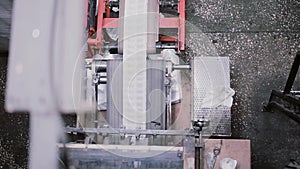 Aerial view of process of printing at a publishing establishment. Paper cut on a machine with sound.