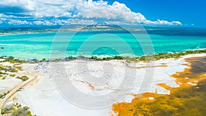 Aerial view of Puerto Rico. Faro Los Morrillos de Cabo Rojo. Playa Sucia beach and Salt lakes in Punta Jaguey.