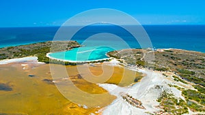 Aerial view of Puerto Rico. Faro Los Morrillos de Cabo Rojo. Playa Sucia beach and Salt lakes in Punta Jaguey.