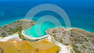 Aerial view of Puerto Rico. Faro Los Morrillos de Cabo Rojo. Playa Sucia beach and Salt lakes in Punta Jaguey.