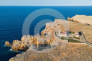 Aerial view of Punta Nati Lighthouse at north coast of Menorca (Balearic Islands)