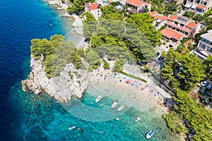 Aerial view of Punta Rata beach with boats and azure sea in Brela, Croatia, Dalmatia, Croatian azure coast