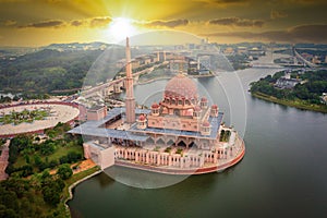 Aerial View Of Putra Mosque with Putrajaya City Centre with Lake at sunset in Putrajaya, Malaysia