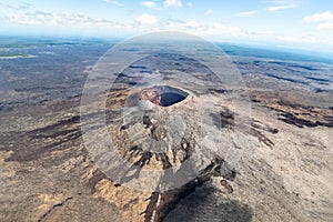 Aerial view of Puu Oo volcanic cone in Hawaii. Volcanic gas escaping from the crater. photo