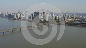 Aerial view of Qiantang River Bridge and modern city skyline in Hangzhou, China