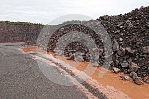 Aerial view into a quarry mine of porphyry rocks.