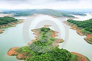 Aerial view of Queen Sirikit Dam in Nan Province, Nan River, Thailand. Rainy season.