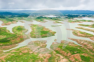 Aerial view of Queen Sirikit Dam in Nan Province, Nan River, Thailand. Rainy season.