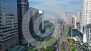 Aerial view of queit traffic on Sudirman street with wisma indocement building on the right. Jakarta is South East Asia