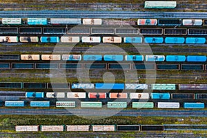 Aerial view of rail sorting freight station with railway carriage, with many rail tracks railroad. Heavy industry landscape