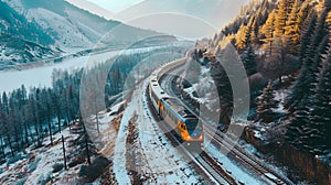Aerial view of railroad transportation by train on track in mountain landscape