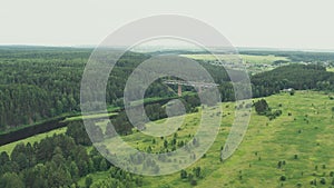 Aerial view of the railway bridge over the river in the forest