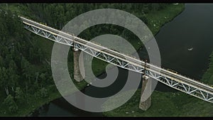 Aerial view of the railway bridge over the river in the forest